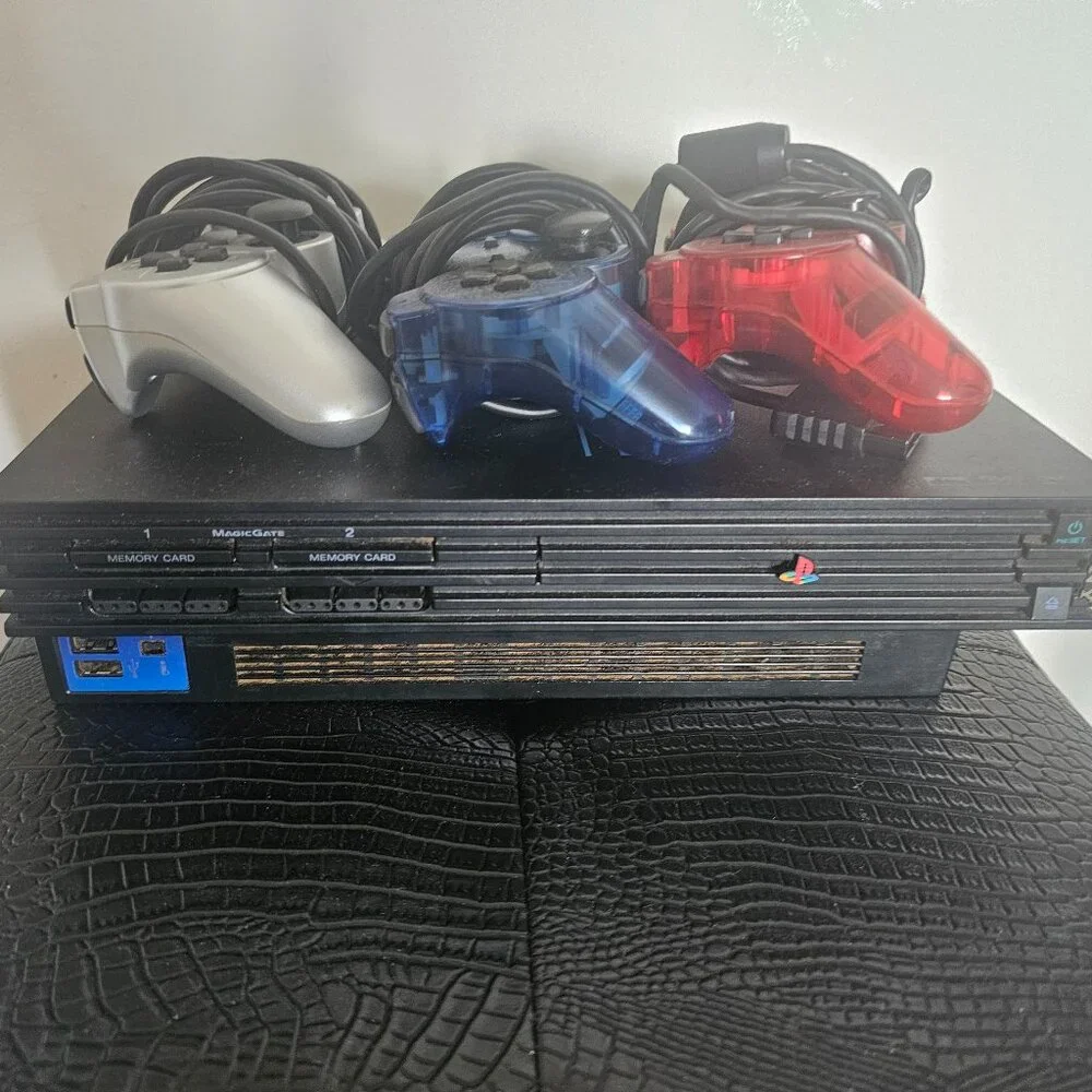 Playsation 2 (PS2 Fat) with controllers and games and PS2 Slim